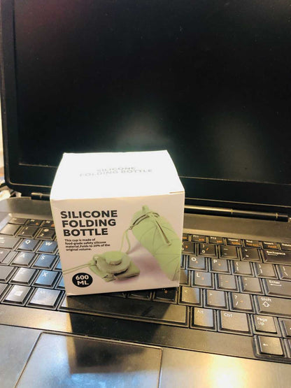 Foldable silicone water bottle shown in travel and outdoor use