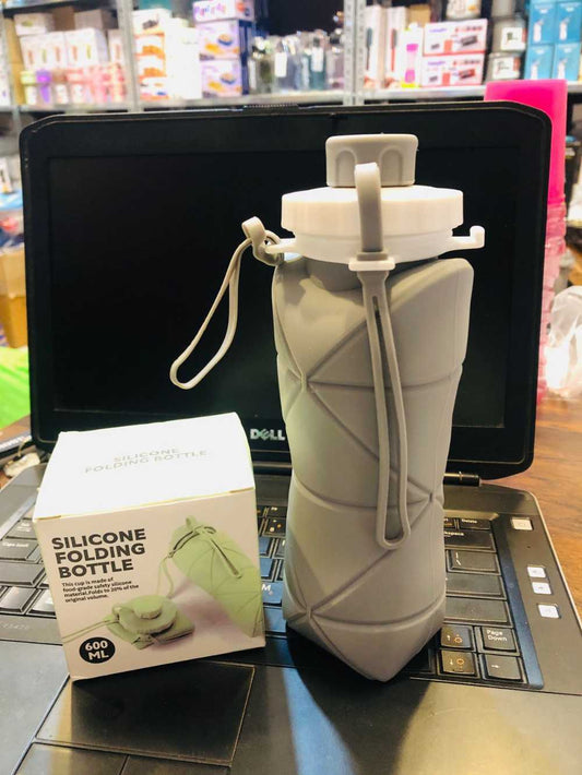 Grey foldable silicone water bottle collapsed to pocket size
